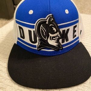 Duke ball cap by Zephyr, black bill, navy front panel with logo, snap back